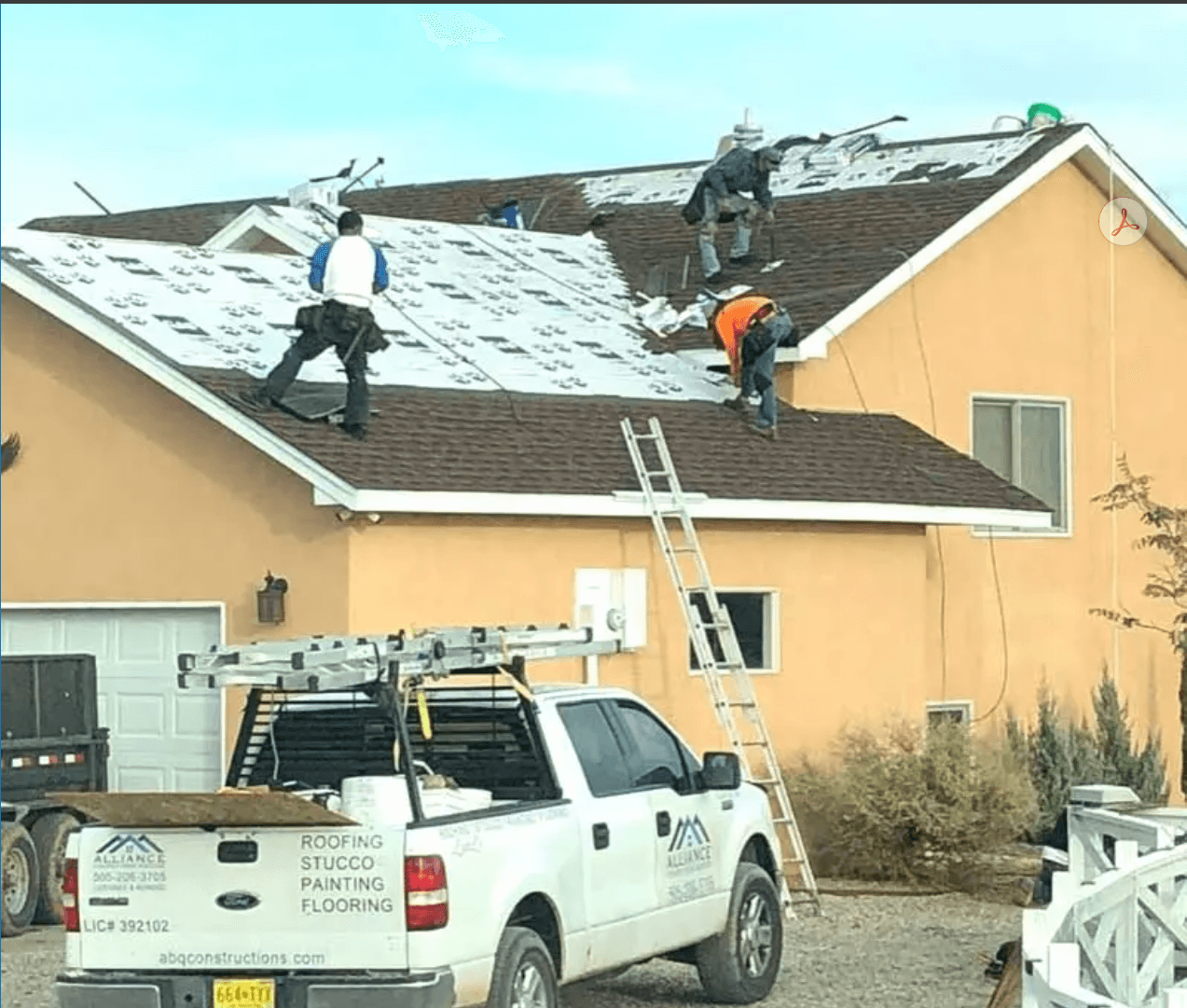Alliance Construction Services crew installing a shingle roof