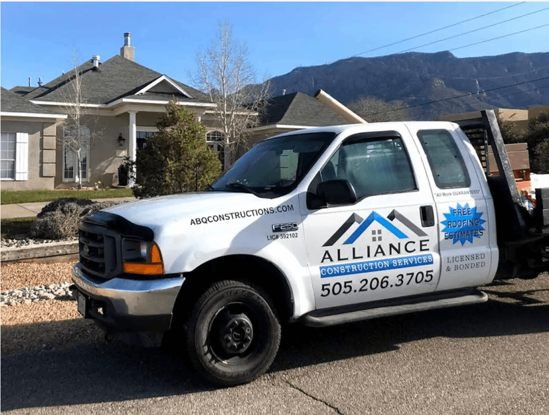 Alliance Construction Services branded work truck on job site